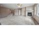 Spacious living room features a fireplace, and large windows at 23312 E Chestnut Pl, Aurora, CO 80016