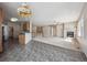 Open-concept living space featuring a kitchen and living room with a fireplace at 23312 E Chestnut Pl, Aurora, CO 80016