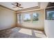 Bright bedroom with large windows, a trey ceiling, and a ceiling fan that offers plenty of natural light at 23312 E Chestnut Pl, Aurora, CO 80016