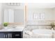 Relaxing bathroom features a modern vanity and a large soaking tub at 4209 S Bannock St, Englewood, CO 80110