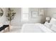 Bright bedroom features stylish decor, a white bed, and modern accents at 4209 S Bannock St, Englewood, CO 80110