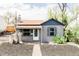 Charming bungalow with gray siding, a quaint front porch, and a well-maintained landscape at 4209 S Bannock St, Englewood, CO 80110
