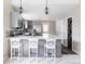 Eat-in kitchen featuring a large island with quartz countertops and modern stainless steel appliances at 4209 S Bannock St, Englewood, CO 80110