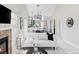 Open-concept living space with fireplace, modern decor, and seamless flow to the kitchen at 4209 S Bannock St, Englewood, CO 80110