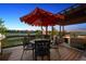 This deck has outdoor seating, a fire pit, and views of the surrounding landscape at 14953 Akron Ct, Brighton, CO 80602