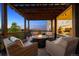 This deck features outdoor seating, a fire pit, a pergola, and views of the surrounding landscape at 14953 Akron Ct, Brighton, CO 80602