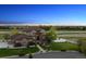 Stunning home exterior with a well-manicured lawn, garden, and a spacious driveway at 14953 Akron Ct, Brighton, CO 80602