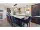 Bright kitchen features a large island with seating, quartz countertops, and pendant lighting at 14953 Akron Ct, Brighton, CO 80602