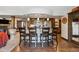 This gourmet kitchen features a kitchen island with a cooktop and dining area with stainless steel appliances at 14953 Akron Ct, Brighton, CO 80602