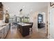 Open concept kitchen with a large island, stainless steel sink, and view into dining area at 14953 Akron Ct, Brighton, CO 80602