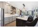Beautiful kitchen with large island with seating, modern appliances, and stylish gray cabinetry at 14953 Akron Ct, Brighton, CO 80602