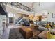 Open living space with a metal railed mezzanine overlooking the fireplace and living space at 14953 Akron Ct, Brighton, CO 80602