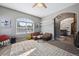 Cozy living room with a large window, comfortable seating and arched doorway at 14953 Akron Ct, Brighton, CO 80602