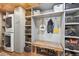 This mud room features a washer and dryer, built-in storage, and a wooden bench at 14953 Akron Ct, Brighton, CO 80602