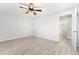 A view of a bedroom featuring light colored walls, modern fan and an open doorway at 580 Vance St # A, Lakewood, CO 80226