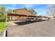 Community parking area with covered parking spaces and well-maintained surroundings at 580 Vance St # A, Lakewood, CO 80226