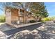 Exterior building featuring brick and siding, complemented by mature trees and balconies at 580 Vance St # A, Lakewood, CO 80226
