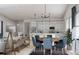 Open-concept dining area connected to a modern kitchen with stainless steel appliances at 2011 Grayside Cir, Castle Rock, CO 80109