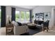 Bright living room featuring a large window, hardwood floors, and contemporary furniture at 2011 Grayside Cir, Castle Rock, CO 80109