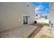 This backyard has a concrete patio and sliding glass door, enclosed by a white fence at 4435 Andes Ct, Denver, CO 80249
