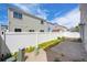 Private fenced backyard featuring a stone patio and low-maintenance landscaping at 4435 Andes Ct, Denver, CO 80249