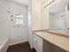 Bright bathroom features a large sink, vanity, toilet, shower, and window at 4435 Andes Ct, Denver, CO 80249