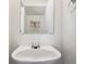 Cozy bathroom featuring a sink, modern fixtures, and artwork in the mirror's reflection at 4435 Andes Ct, Denver, CO 80249
