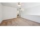 A carpeted bedroom offers neutral walls, a ceiling fan, and spaciousness at 4435 Andes Ct, Denver, CO 80249