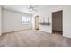 Bright bedroom with a large window, closet, ceiling fan, and neutral carpeting at 4435 Andes Ct, Denver, CO 80249