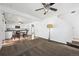 Combined living room and kitchen area with carpet and hardwood floors with abundant natural light at 4435 Andes Ct, Denver, CO 80249
