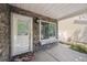 Inviting front porch with stone accents, a window seat, decorative lighting, and a welcoming entrance at 4435 Andes Ct, Denver, CO 80249