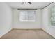 Bright bedroom has neutral carpet, ceiling fan and a window providing lots of natural light at 4802 E Kentucky Ave # E, Denver, CO 80246