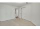 A bedroom with neutral carpet and a closet with double doors provides ample storage space at 4802 E Kentucky Ave # E, Denver, CO 80246