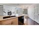 Kitchen with granite countertops, stainless steel appliances, and hardwood floors open to living area at 4802 E Kentucky Ave # E, Denver, CO 80246