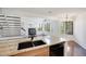 Modern kitchen featuring granite countertops, stainless steel appliances, and an open concept layout at 4802 E Kentucky Ave # E, Denver, CO 80246