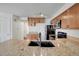 Granite counters, stainless steel appliances, and an undermount sink add a level of sophistication to the kitchen at 4802 E Kentucky Ave # E, Denver, CO 80246