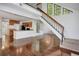 Open floor plan with hardwood floors, a staircase, kitchen and abundant natural light at 4802 E Kentucky Ave # E, Denver, CO 80246