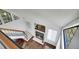 Open-concept living area with fireplace, adjacent to staircase and bright windows at 4802 E Kentucky Ave # E, Denver, CO 80246