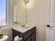 Small half bathroom with vanity and single sink at 10141 Brady Pl, Highlands Ranch, CO 80130