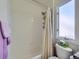 Simple bathroom with shower/tub combo and window at 10141 Brady Pl, Highlands Ranch, CO 80130