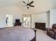 Main bedroom with access to a second floor loft, walk-in closet, and ensuite bathroom at 10141 Brady Pl, Highlands Ranch, CO 80130