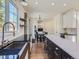 Spacious kitchen featuring modern appliances and an island at 10141 Brady Pl, Highlands Ranch, CO 80130