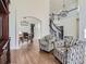 Open concept living room with hardwood floors and a view into the dining room at 10141 Brady Pl, Highlands Ranch, CO 80130