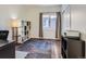 Home office with built-in shelving and hardwood floors at 10141 Brady Pl, Highlands Ranch, CO 80130