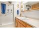 Well-lit bathroom features updated vanity and walk-in shower at 3300 W Florida Ave # 51, Denver, CO 80219