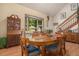 Cozy dining area with a bay window, wood floors, and ample natural light at 3300 W Florida Ave # 51, Denver, CO 80219