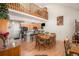 Open-concept living space featuring wood floors, a breakfast bar, and a loft area at 3300 W Florida Ave # 51, Denver, CO 80219