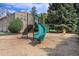 Community playground area featuring a slide, climbing structure, and soft landing surface for safety at 3300 W Florida Ave # 51, Denver, CO 80219
