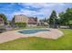 Community pool area, with partially covered pool, and residential buildings and trees in the background at 3300 W Florida Ave # 51, Denver, CO 80219