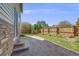 A spacious backyard features a stamped concrete patio, green lawn, and wood fence at 19294 E Warren Pl, Aurora, CO 80013